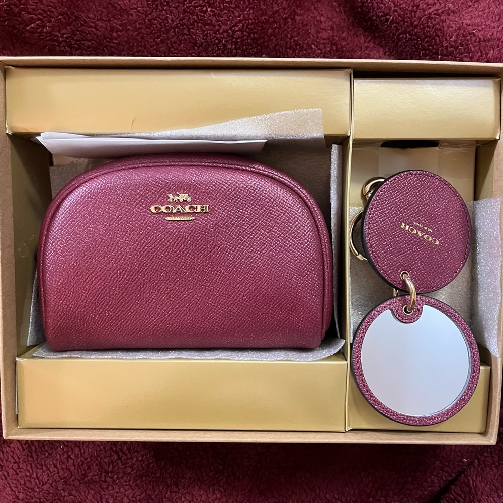New Coach Cosmetic Bag and Mirrored Purse Charm. Color- glittered black cherry